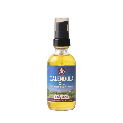 Bottle of calendula oil with a blue label on a white background