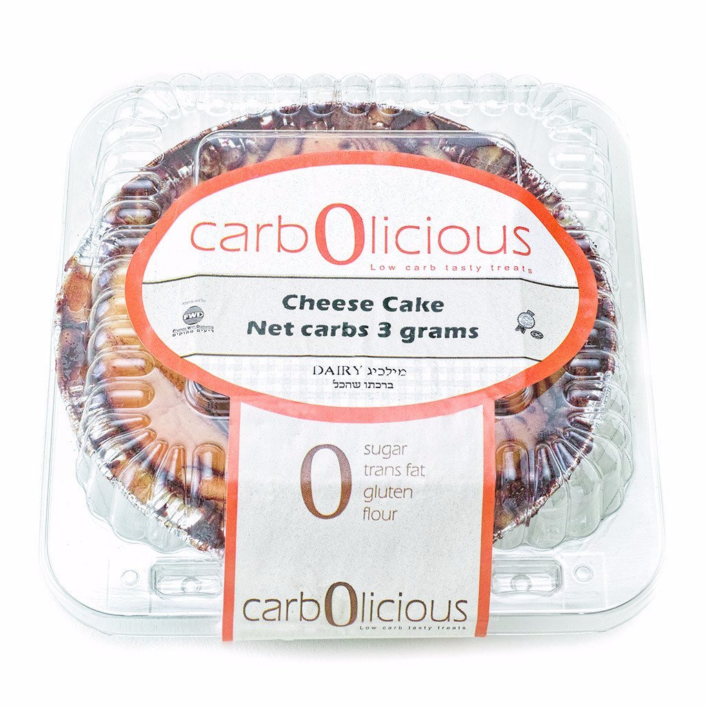 Carbolicious low-carb sugar-free cheesecake in clear plastic packaging, keto-friendly dessert with 3g net carbs, gluten-free, kosher, and zero sugar on a white background.