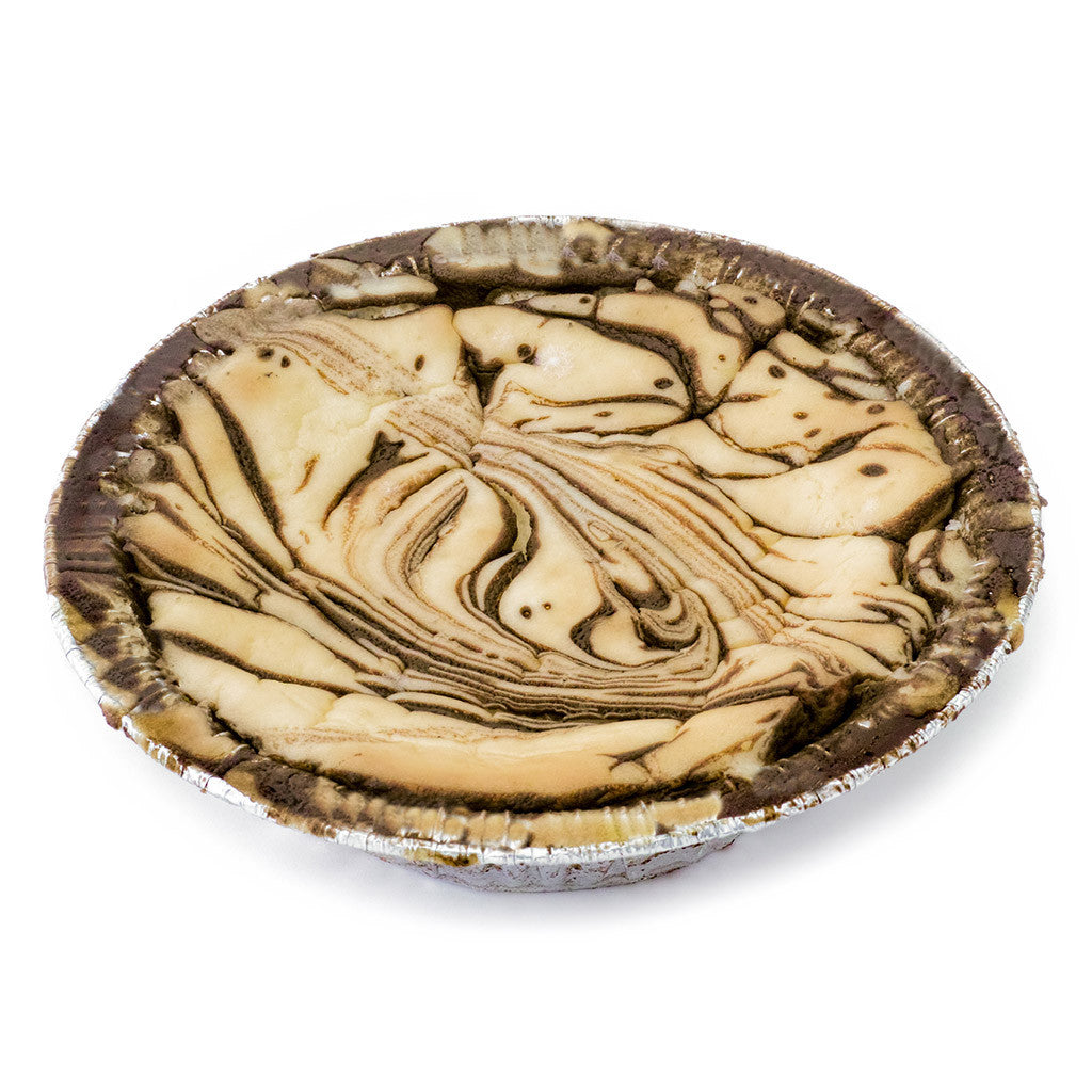 Marble swirl chocolate mousse pie in a foil pie tin, featuring creamy vanilla and rich chocolate swirls on a white background. Carbolicious low-carb sugar-free cheesecake keto-friendly dessert with 3g net carbs, gluten-free, kosher, and zero sugar.