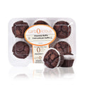 Pack of six Carbolicious low-carb, sugar-free chocolate muffins in a clear plastic bakery container with one muffin displayed outside the package on a white background. Label highlights **3g net carbs per muffin**, making it suitable for low-carb and keto lifestyles.