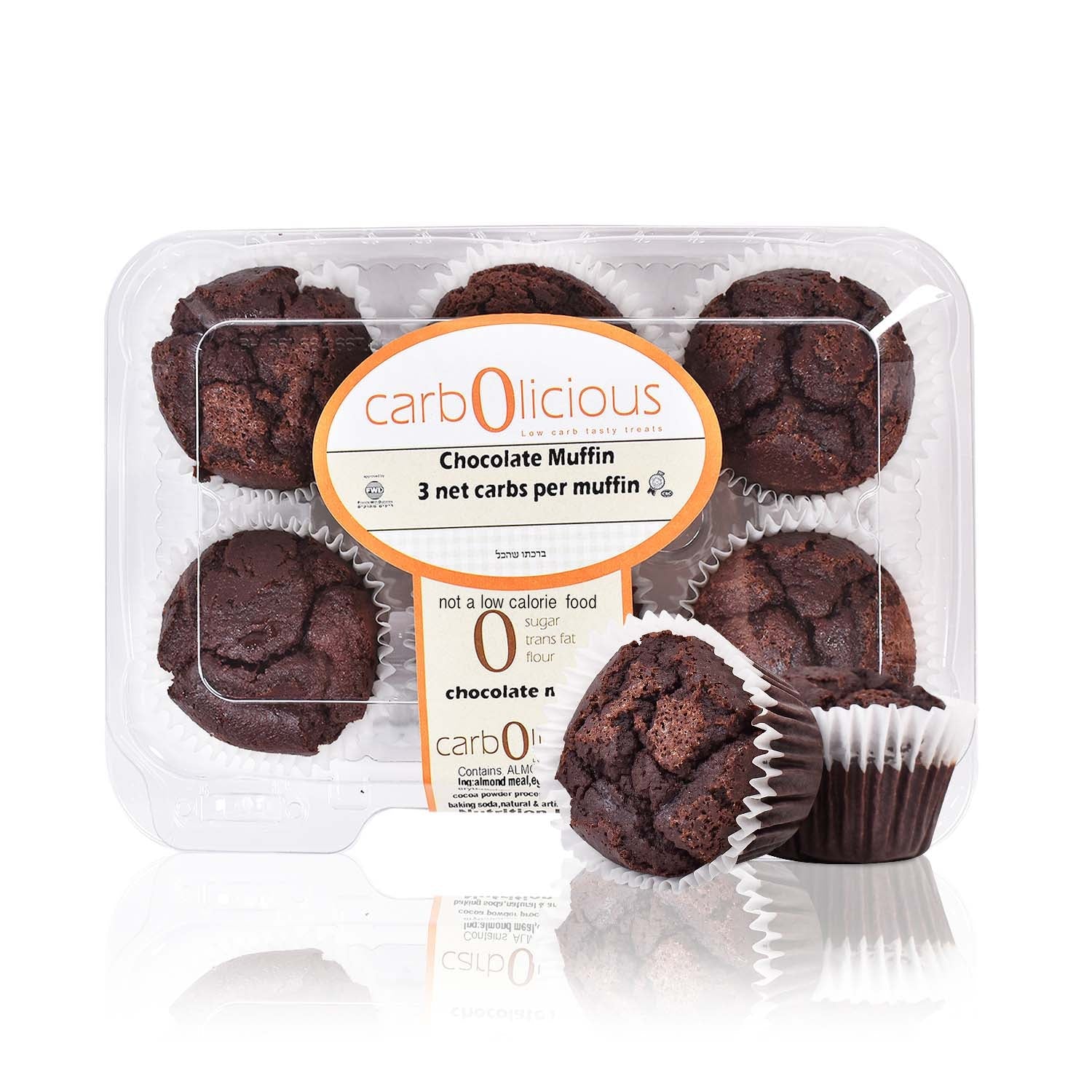 Pack of six Carbolicious low-carb, sugar-free chocolate muffins in a clear plastic bakery container with one muffin displayed outside the package on a white background. Label highlights **3g net carbs per muffin**, making it suitable for low-carb and keto lifestyles.