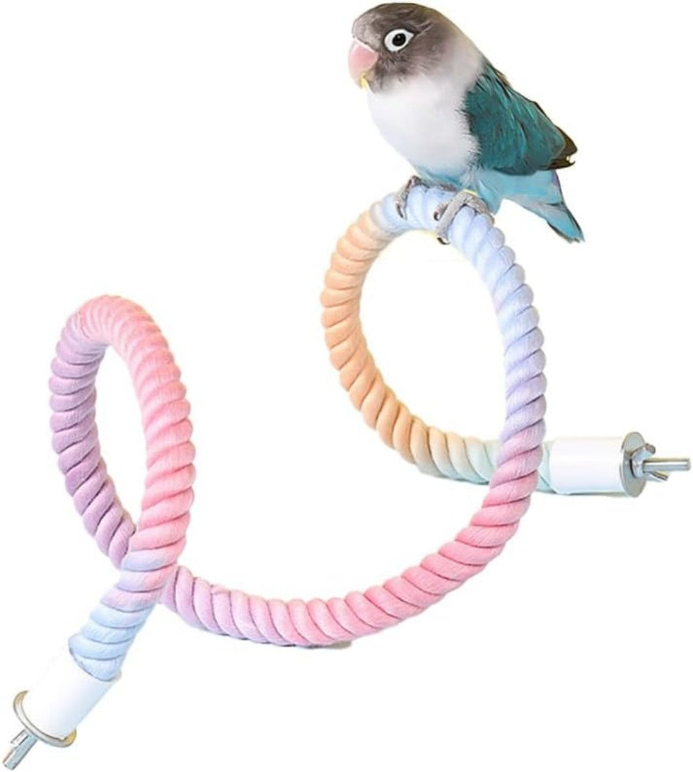 Flexible gradient rainbow bird rope perch with a blue lovebird perched on top against a white background. Bendable cotton climbing perch with secure metal end caps, designed for parrots, parakeets, cockatiels, budgies, conures, lovebirds, finches, canaries, and other small pet birds. Ideal for climbing, balancing, exercising, and comfortable perching in bird cages.