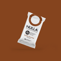 NULLA double chocolate protein bar packaging on a brown background