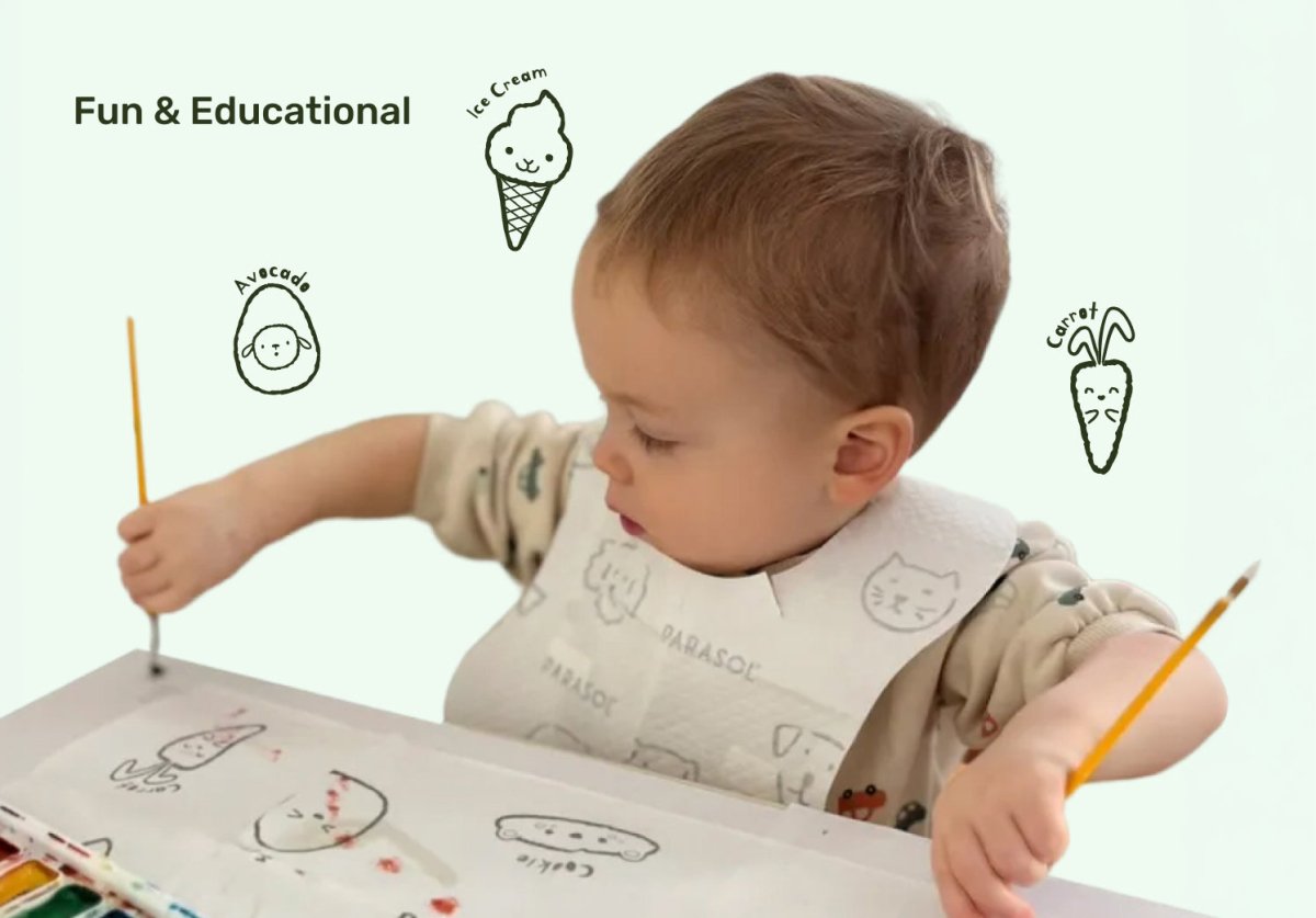 Child coloring with crayons on a book, surrounded by simple illustrations of ice cream, avocado, and carrot. Baby placemats.