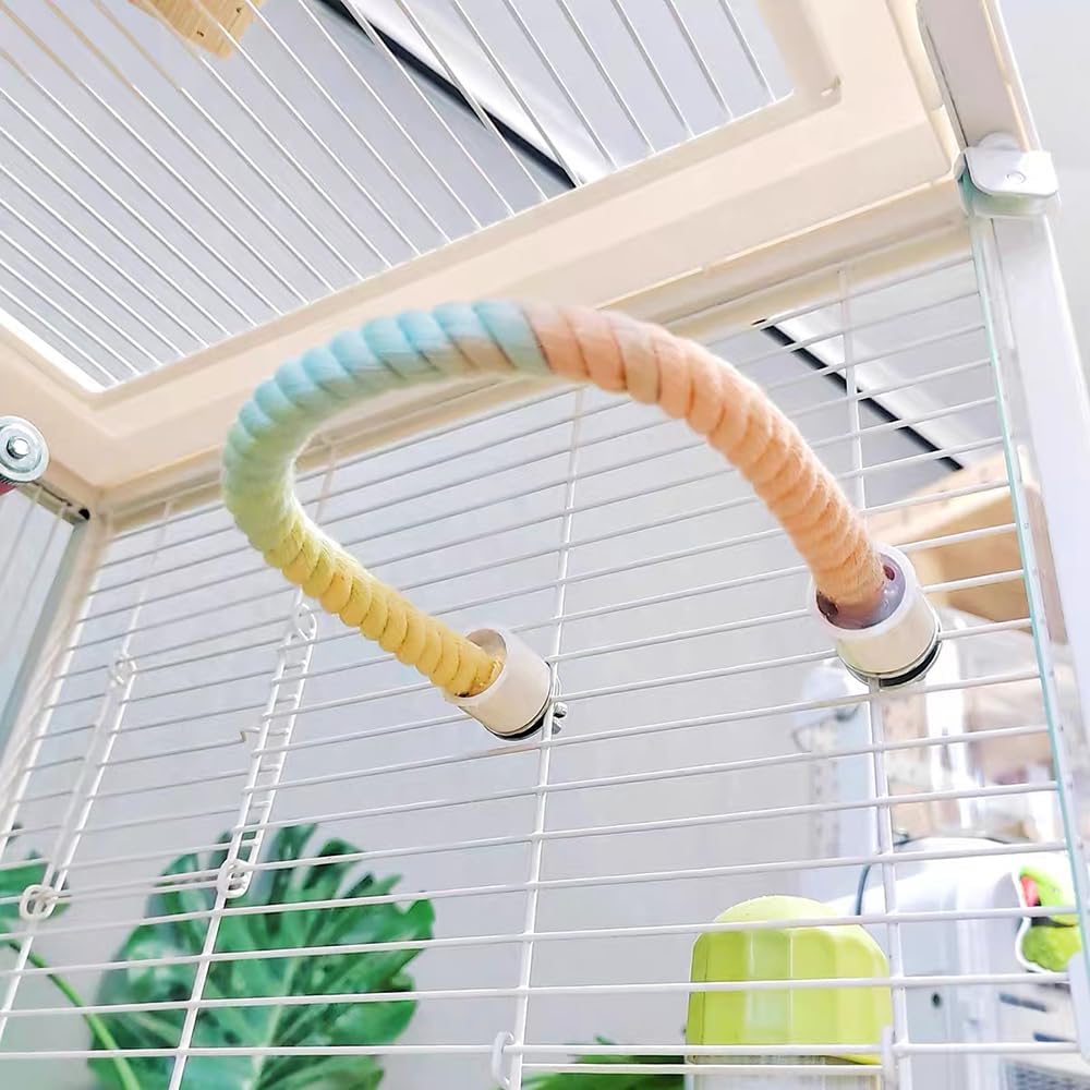 Flexible gradient rainbow rope perch installed inside a bird cage, providing a colorful bendable climbing and balancing perch for parrots, parakeets, cockatiels, budgies, conures, lovebirds, canaries, finches, and other small pet birds.