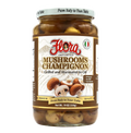 Jar of Flora Imported Mushrooms Champignon, grilled and marinated in oil, 19 oz glass jar on a white background.