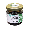 Jar of Mitica® Forest Honey in a glass jar with a gold lid on a white background.