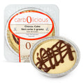 Carbolicious low-carb sugar-free cheesecake dessert with rich chocolate drizzle in a single-serve foil pan, sealed in retail packaging, keto-friendly, gluten-free, kosher dairy refrigerated cheesecake.