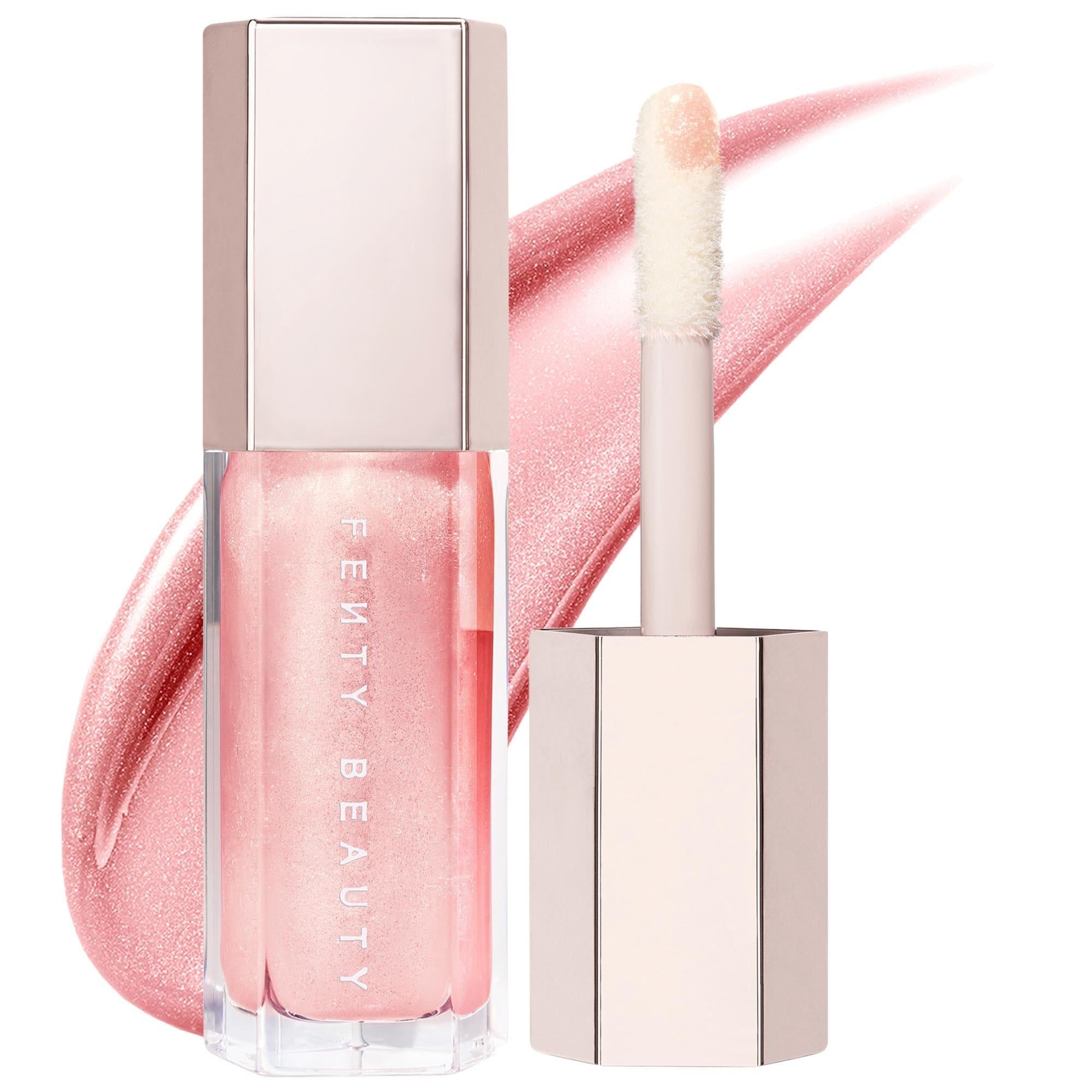 Lip gloss with applicator and 'Fenty Beauty' branding on a pink background
