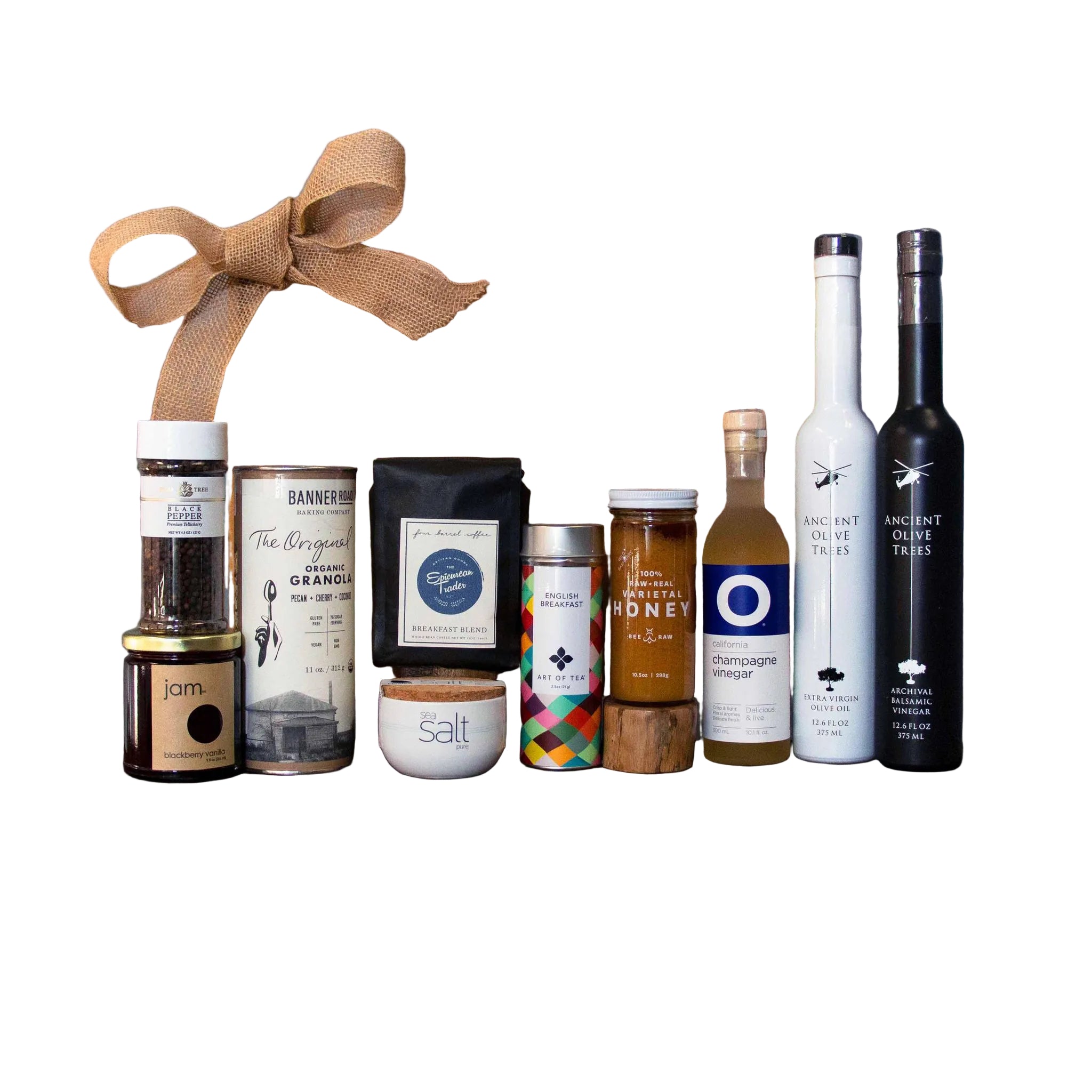 Collection of gourmet food and beverage items on a wooden board with 'The Epicurean Trader' box in the background.