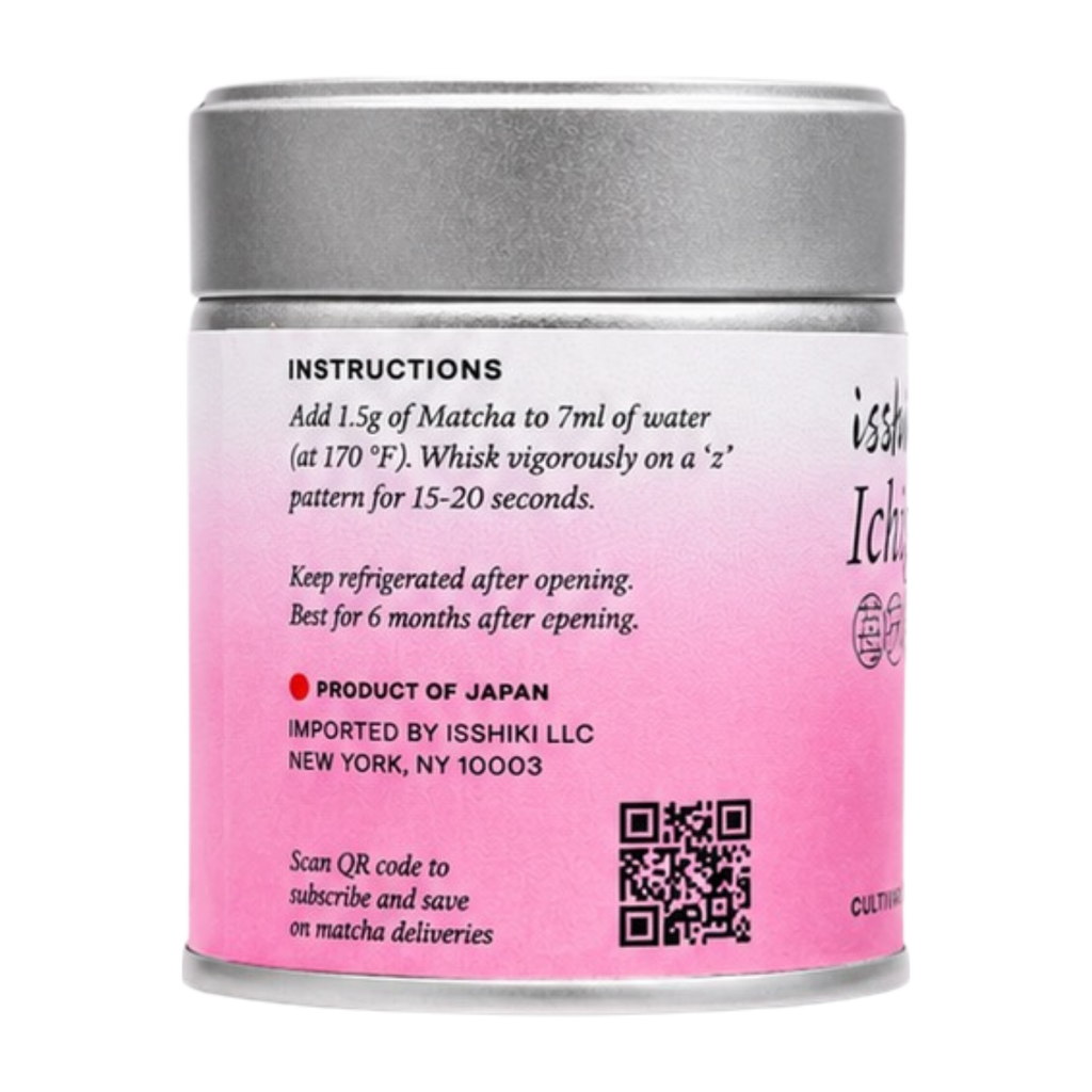 Pink canister with silver lid containing matcha powder, featuring instructions and branding.