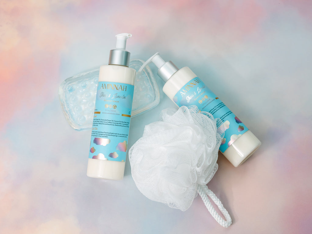 Two bottles of skincare products with a loofah on a colorful background. Eczema (Shea & Lanolin) Gentle Cleanser. Clean Beauty Commitment, Clean beauty inspired. Made with skin-loving ingredients, Cruelty-free, Female-owned brand