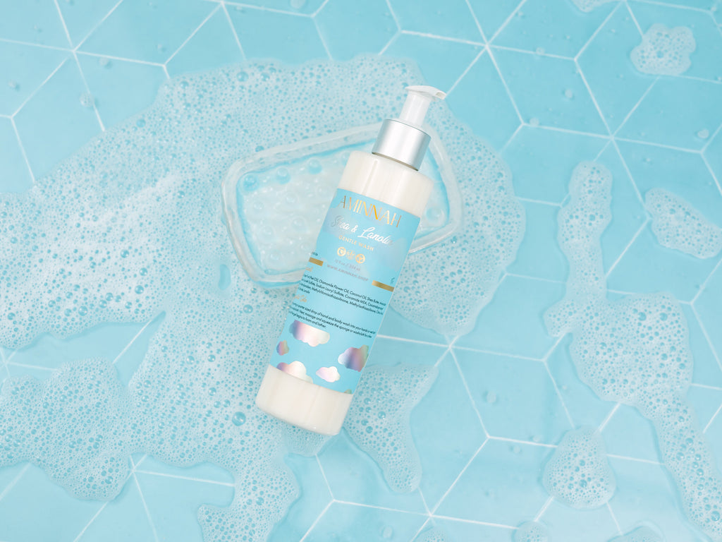 Foaming bottle with blue label on a blue tiled background. Eczema (Shea & Lanolin) Gentle Cleanser. Clean Beauty Commitment, Clean beauty inspired
Made with skin-loving ingredients, Cruelty-free, Female-owned brand