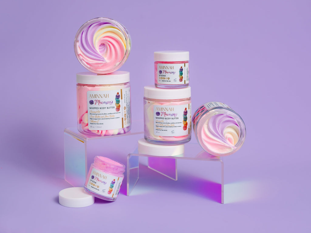 Macaron Lip Scrub display featuring whipped, pastel-swirled lip scrub jars made with natural, lip-safe ingredients. Clean beauty, cruelty-free, vegan skincare by a female-owned brand that gently exfoliates, nourishes, and hydrates lips for a soft, smooth finish with a sweet macaron-inspired scent.