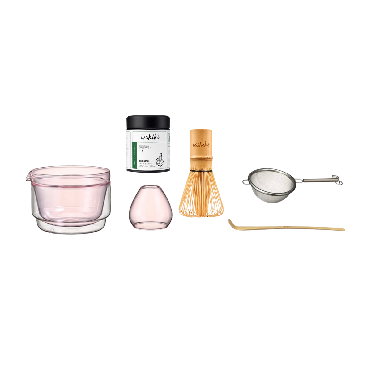 Collection of tea-making tools including a glass cup, container, whisk, and other accessories on a white background.