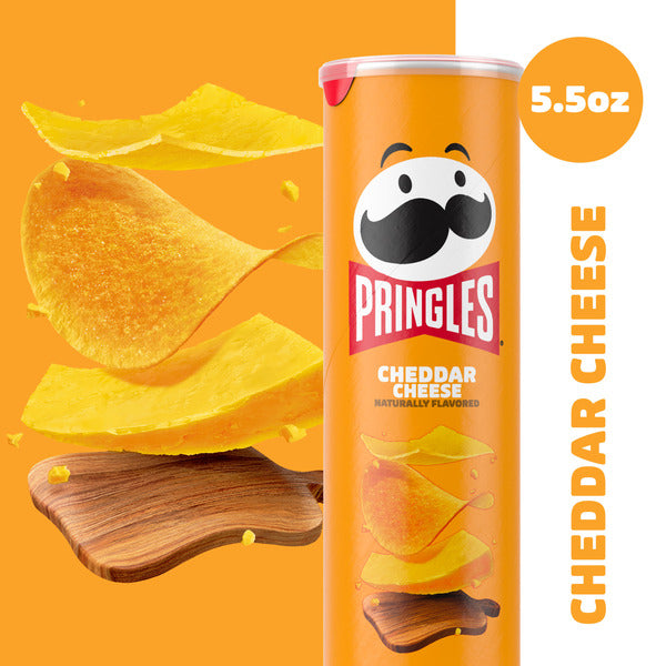 Pringles Cheddar Cheese potato chip can with chips on an orange background