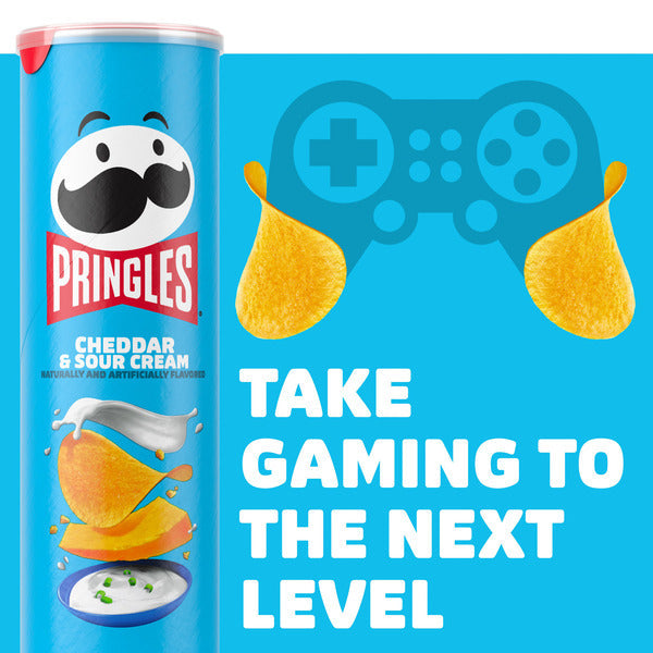 Pringles Cheddar & Sour Cream can with gaming controller and chips graphic on blue background