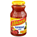 Jar of La Victoria Suprema Salsa with yellow lid on a white background