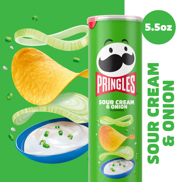 Pringles Sour Cream & Onion potato crisps can with sour cream dip, onion slices, and potato chips on a green promotional background, 5.5 oz.