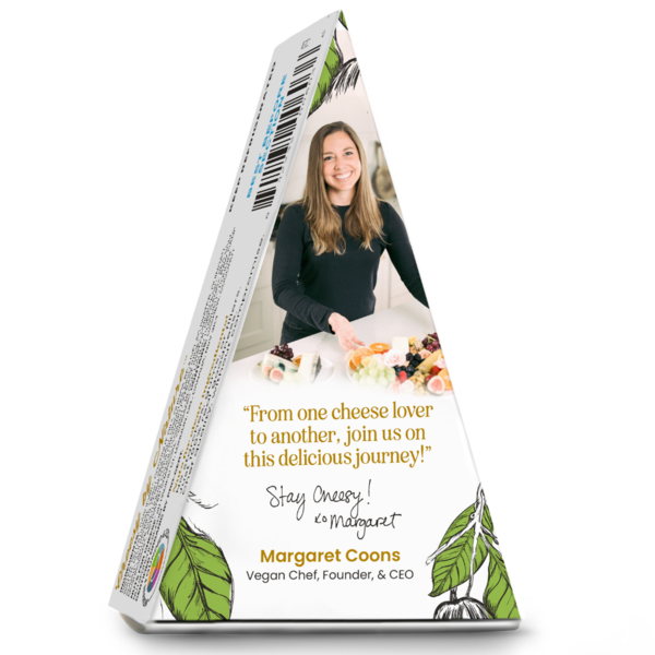 Black garlic dairy-free cheese package featuring Nuts For Cheese founder Margaret Coons with a serving platter, organic vegan cheese wedge packaging, and founder message on a white background.