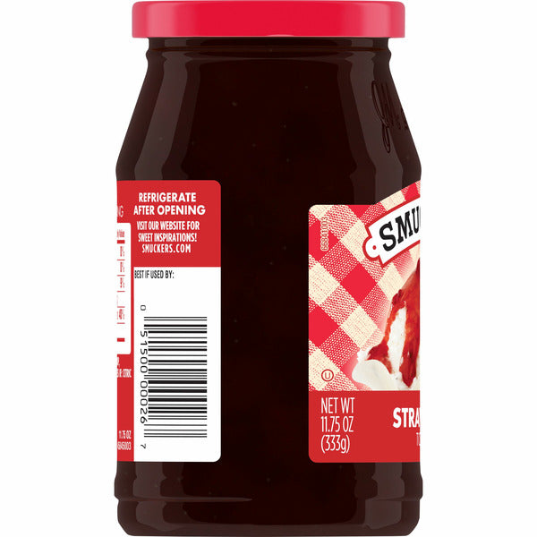Jar of Smuckers strawberry sauce with a red lid and label on a white background