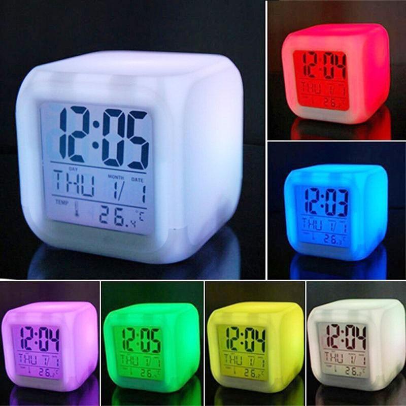 Digital clock with colorful LED display in various colors on a black background