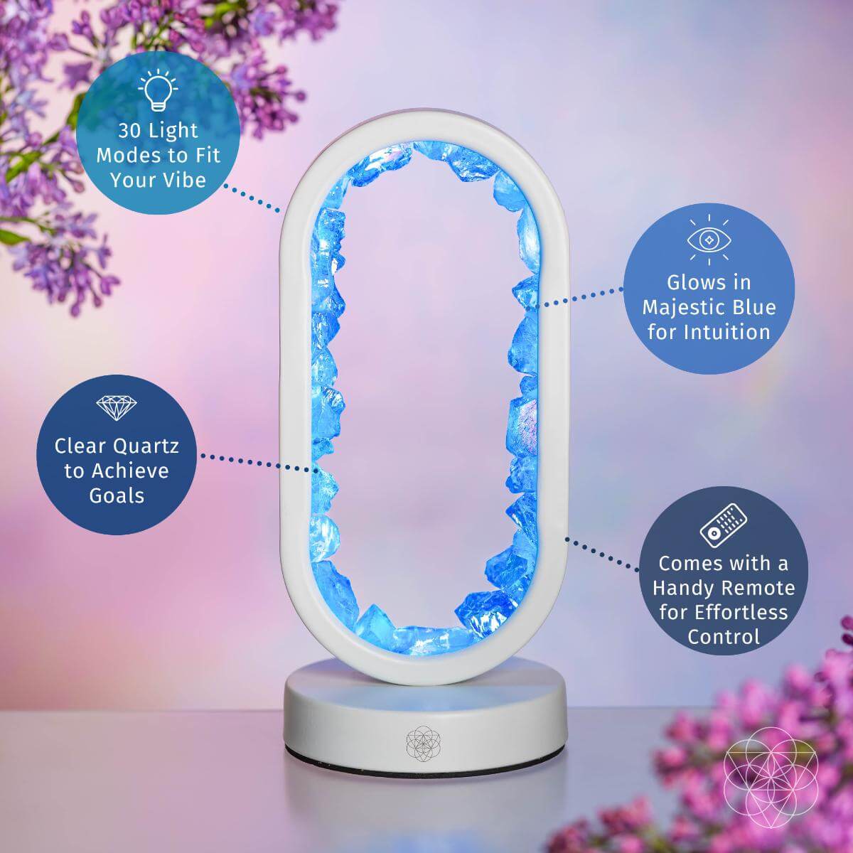 Decorative lamp with blue light modes, remote control, and clear quartz on a blurred floral background. Manifest Success - Clear Quartz Lamp of Achievement