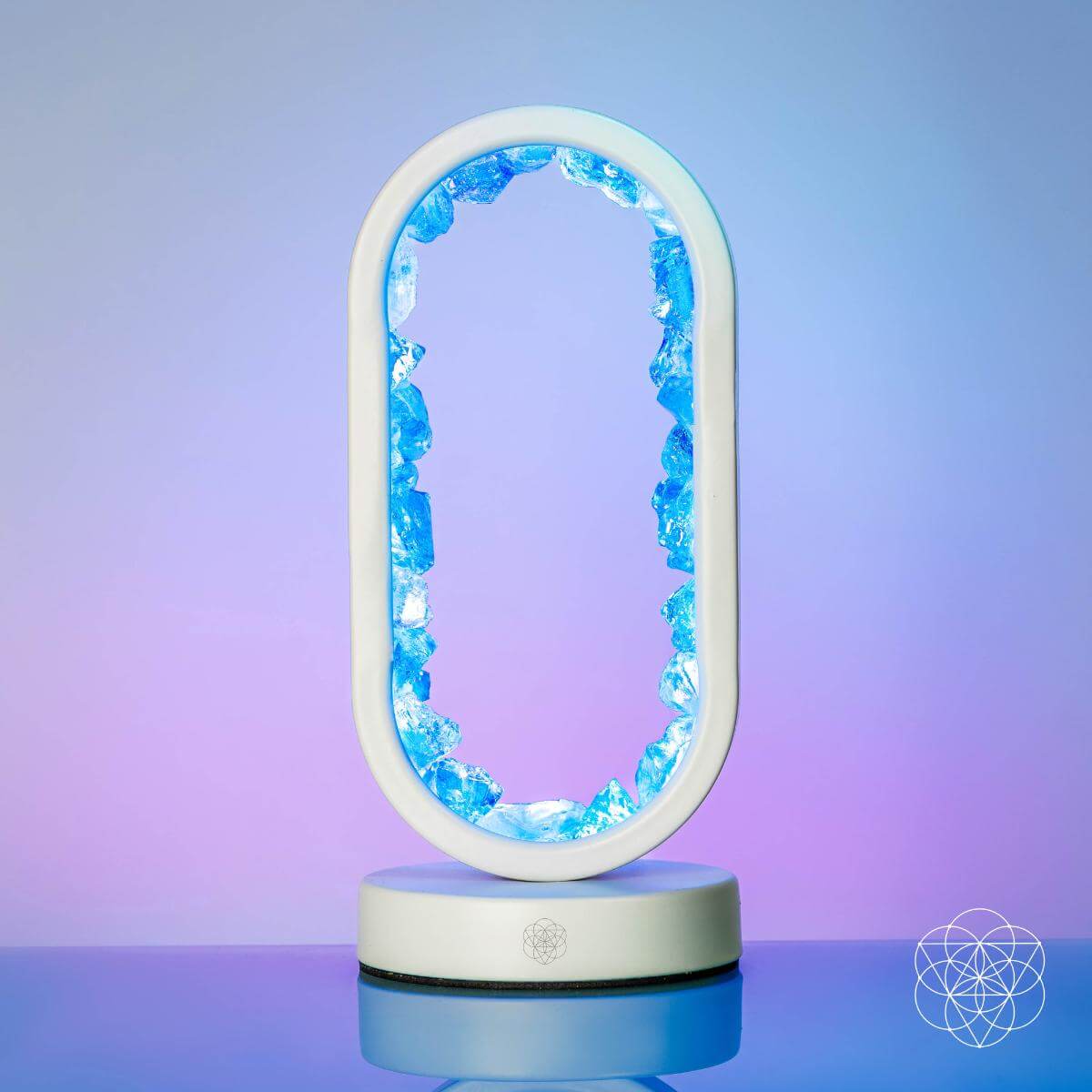Decorative lamp with blue interior and white exterior on a gradient background. Manifest Success - Clear Quartz Lamp of Achievement