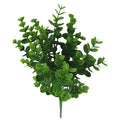 Artificial green foliage on a white background