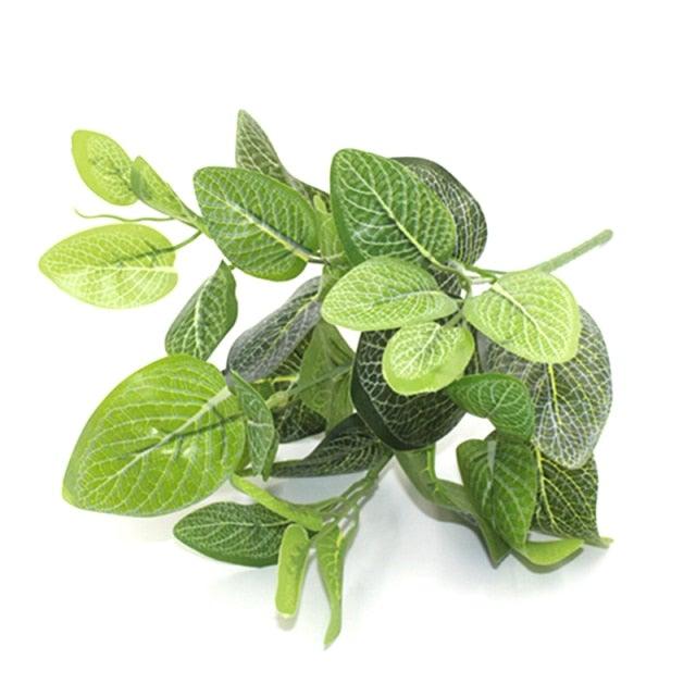 Artificial green leaves on a white background