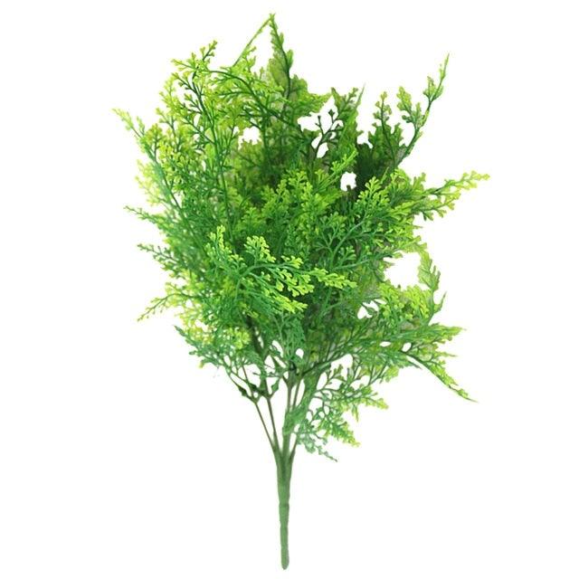 Artificial green bush on a white background