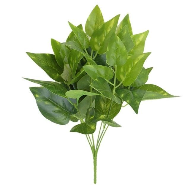 Artificial green leaves on a white background