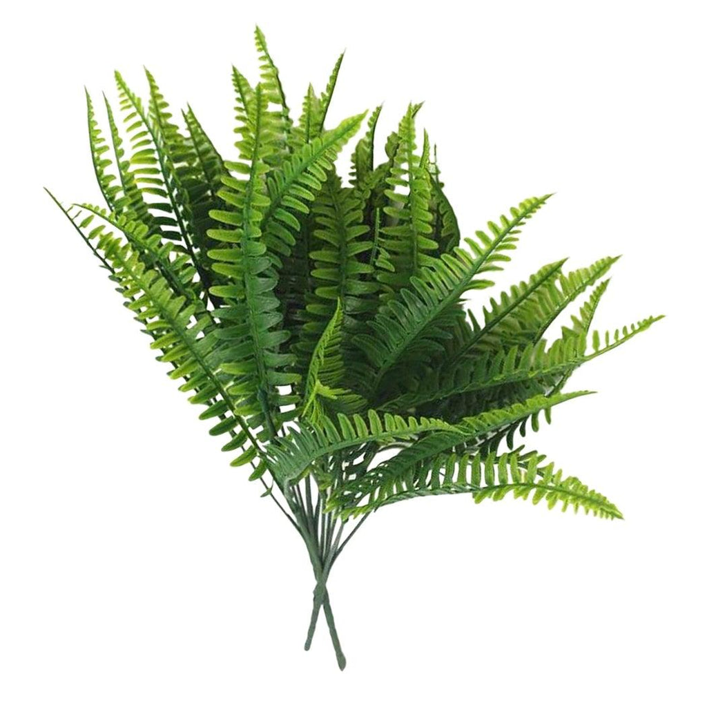 Artificial fern plant on a white background