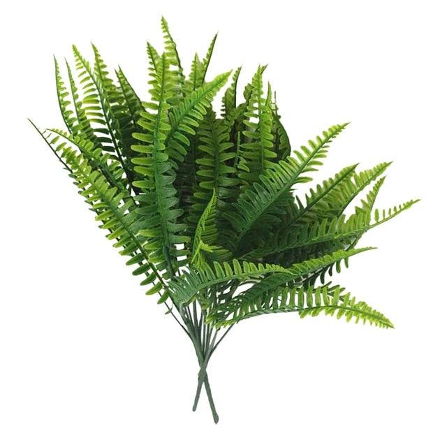 Artificial fern plant on a white background