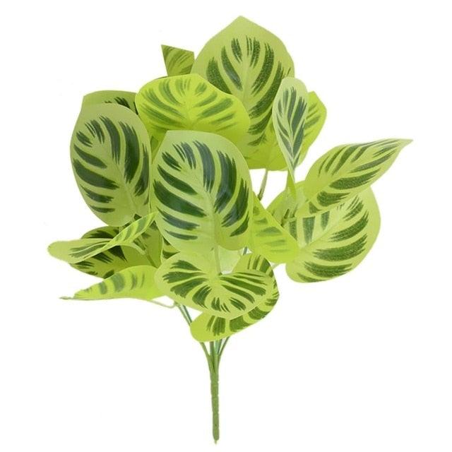 Artificial green leaf plant on a white background