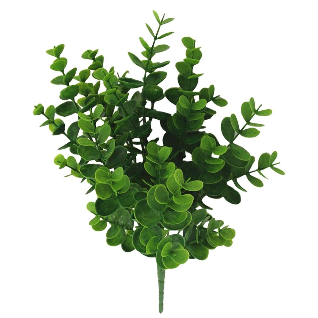 Artificial green foliage on a white background