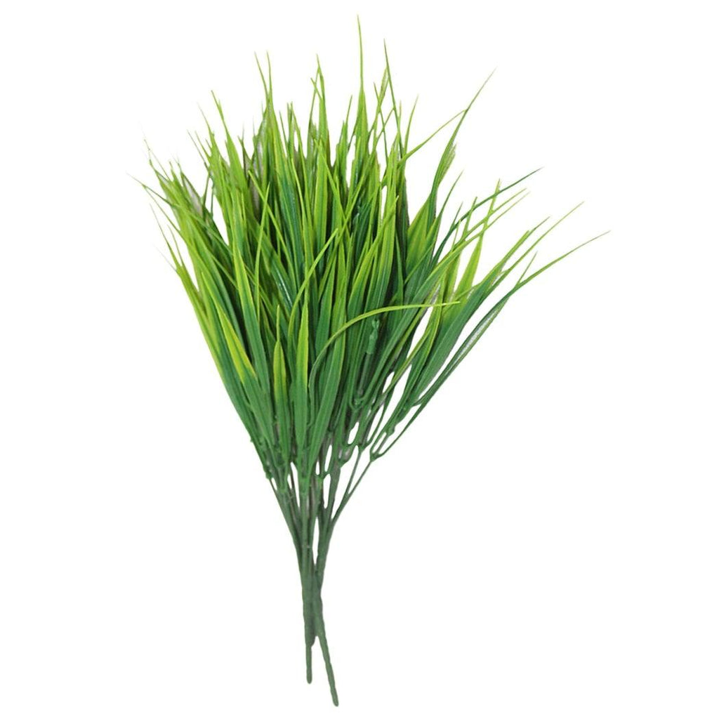 Artificial green grass on a white background