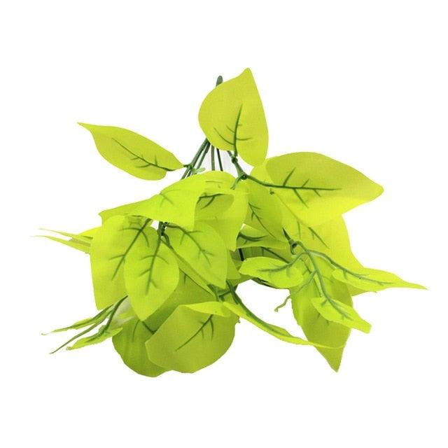 Artificial green leaves on a white background