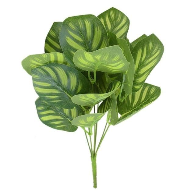 Artificial green leaves with a white background