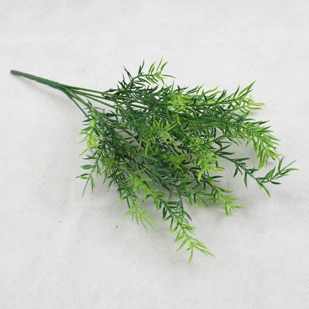 Artificial green plant on a white background