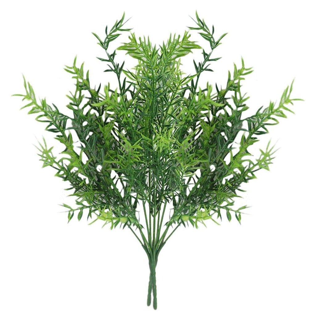 Artificial green plant bush on a white background
