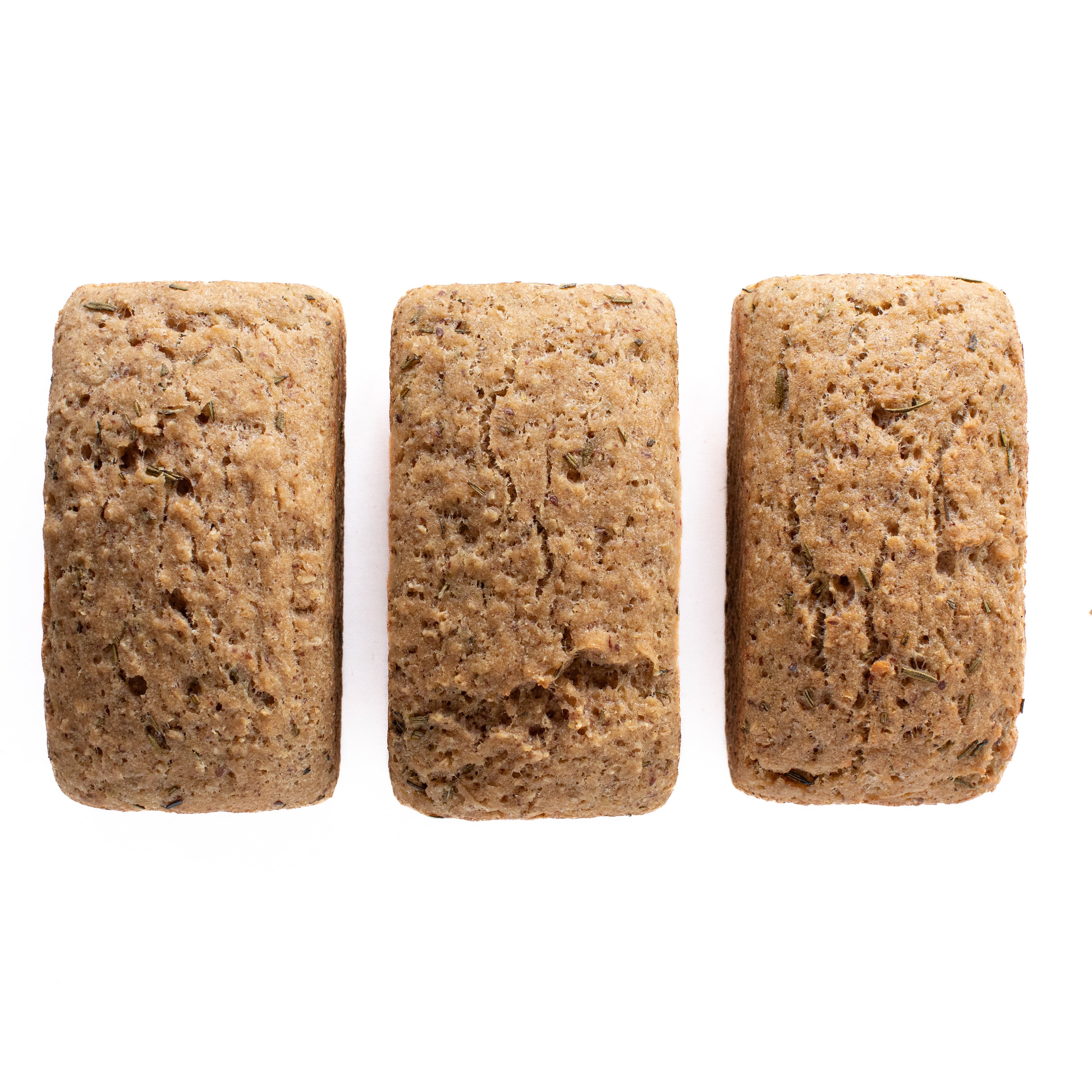 Organic gluten-free rosemary and olive oil sourdough bread loaves arranged side by side on a white background.