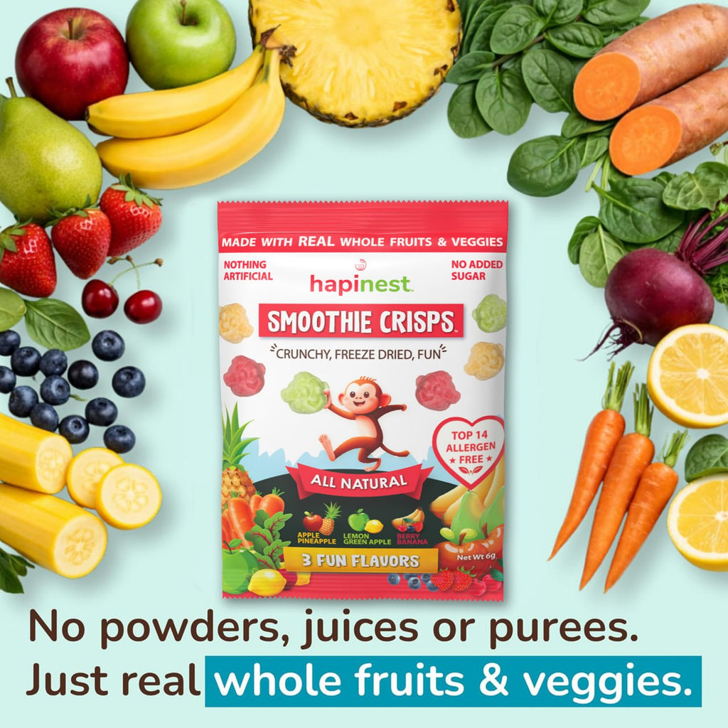 A package of hapinest Smoothie Crisps snack mix is centered on a light blue background, surrounded by whole fruits and vegetables including bananas, strawberries, apples, carrots, spinach, blueberries, and lemons. Text at the bottom reads, 'No powders, juices or purees. Tree Nut-Free, Peanut-Free, Egg-Free, Dairy-Free, Wheat-Free, Fish-Free, Sesame-Free, Celery-Free, Lupin-Free, Soy-Free, Shell-Fish Free, Gluten-Free, Mustard-Free, Sulphites-Free.