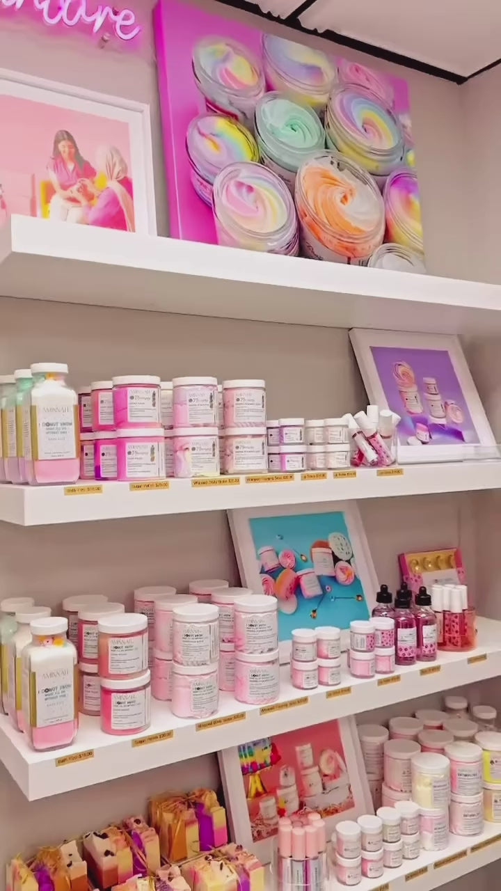 AMINNAH skincare collection displayed on elegant retail shelves featuring clean beauty, cruelty-free, paraben-free, gluten-free, vegan skincare made with natural ingredients. Female-owned brand offering luxurious body butters, scrubs, oils, and skincare in recyclable packaging, beautifully merchandised for a premium shopping experience at Tree of Life Grocers.