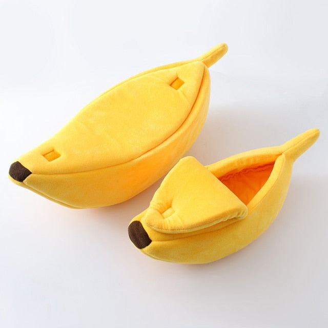 Yellow banana-shaped plush pet bed with a cozy cave design for cats, kittens, puppies, and small dogs on a white background.