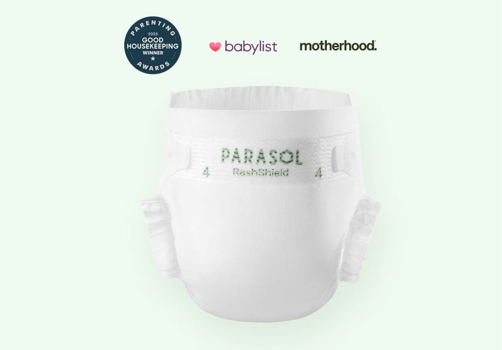 Parasol RashShield® Pure White disposable baby diaper featuring a clean white design with award logos from Good Housekeeping, Babylist, and Motherhood, highlighting soft, breathable, ultra-absorbent protection for sensitive skin.