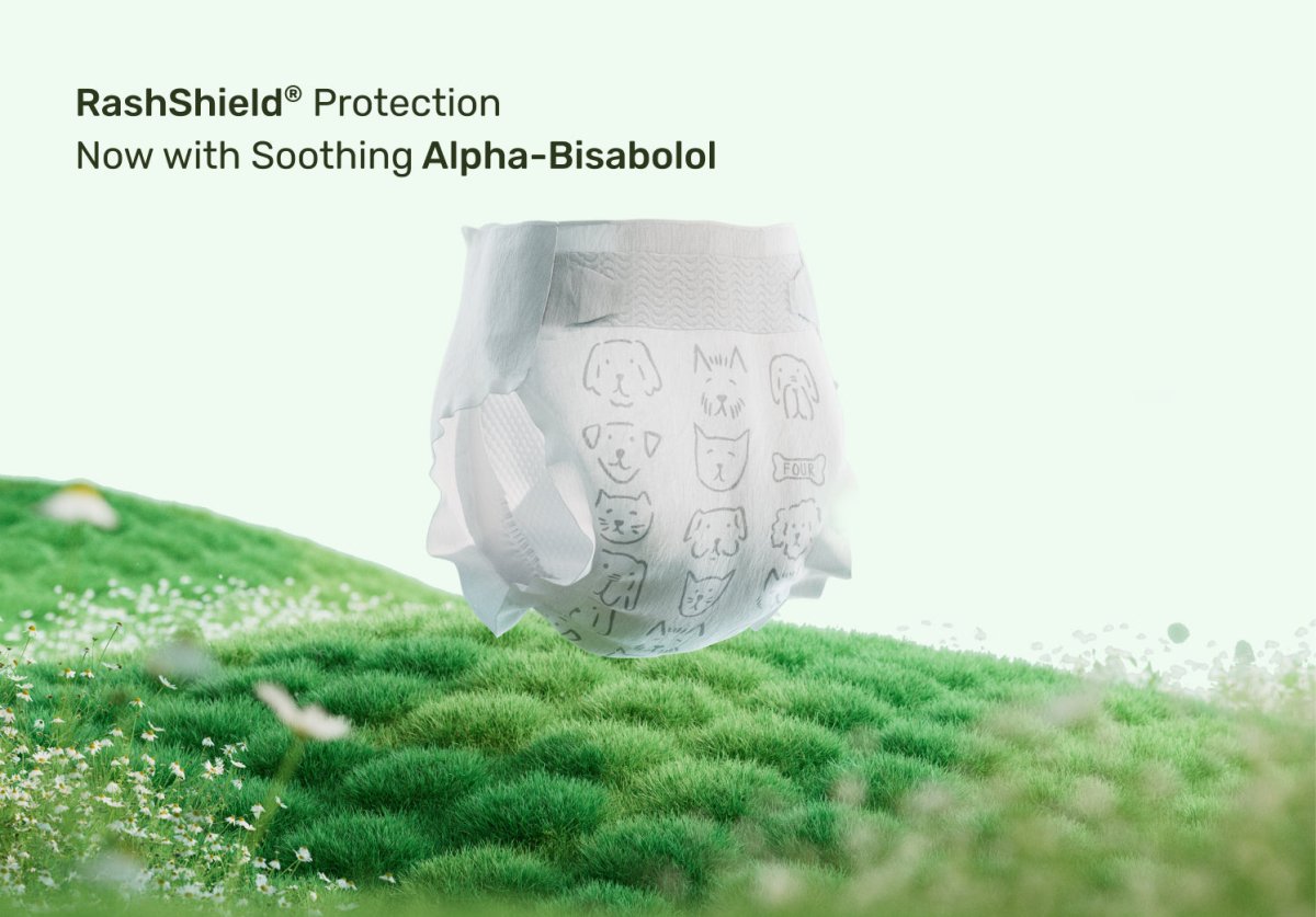 Diaper with RashShield protection on a grassy background. Safe and clean baby diapers.