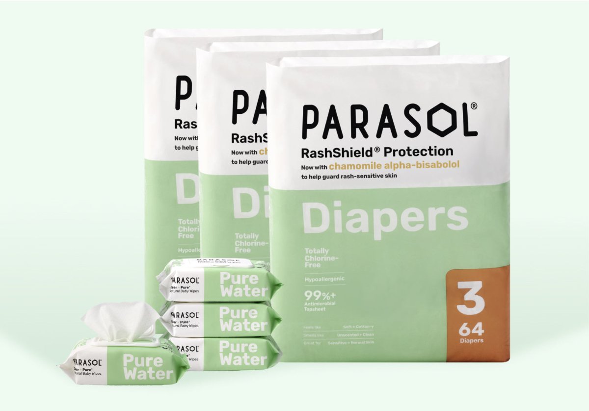 Parasol RashShield® disposable baby diapers with Pure Water baby wipes displayed together on a soft light green background, highlighting premium hypoallergenic diaper care, Totally Chlorine-Free materials, and gentle skin protection for babies.