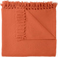 Orange throw blanket with frayed edges on a white background. Diamond Jacquard Throw Rust