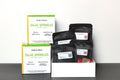 World Spice Salad Sprinkles Tasting Flight gift set featuring four gourmet seasoning blends, including Greek, Ranch, Nigella Caesar, and Tellicherry Black Pepper, with artisan spice pouches displayed in a white tasting tray and retail boxes on a clean white background.